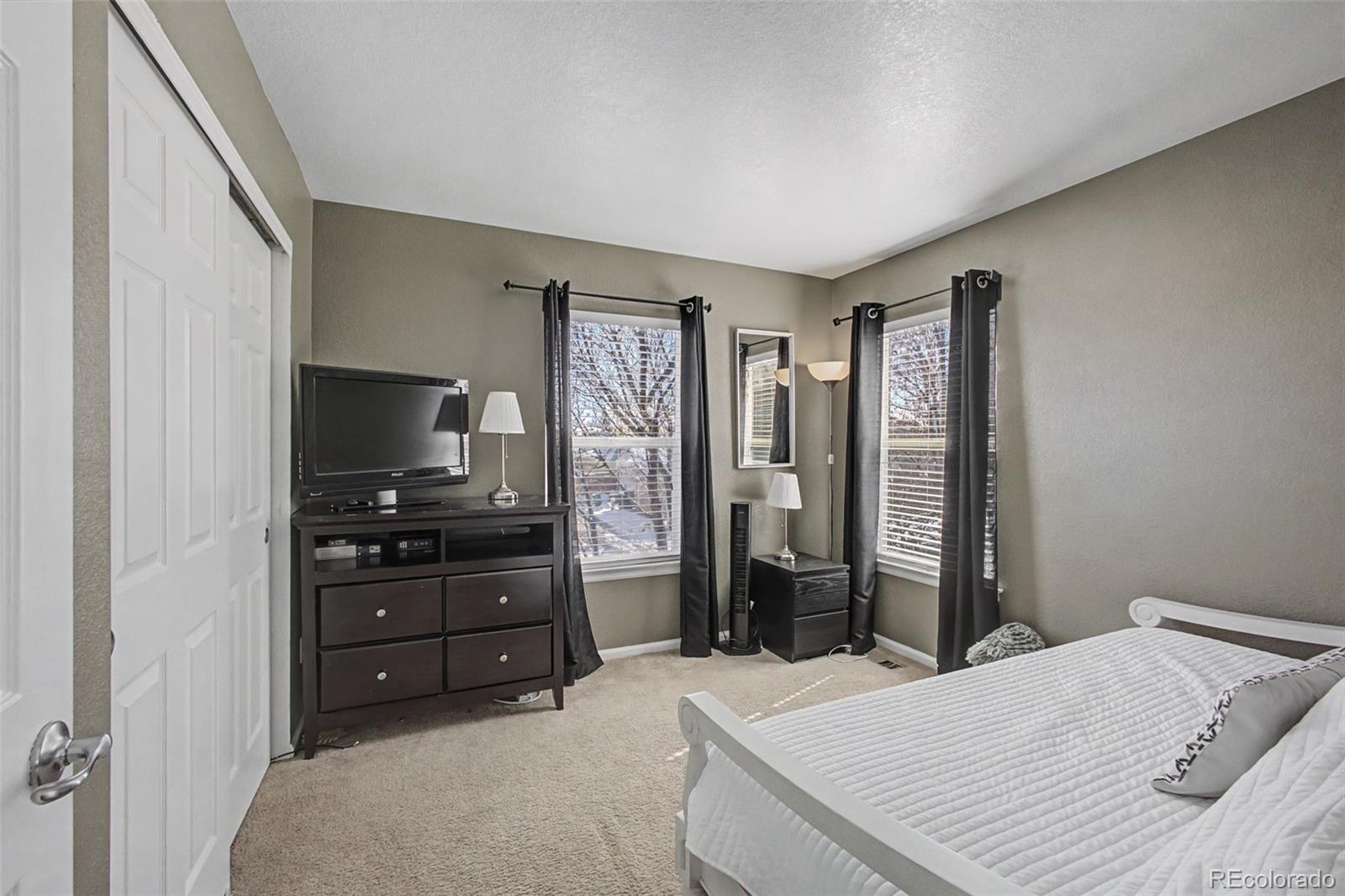2921 Fulton Street Denver, CO 80238 - Photo 25 of 42 a room with a bed and a television in it