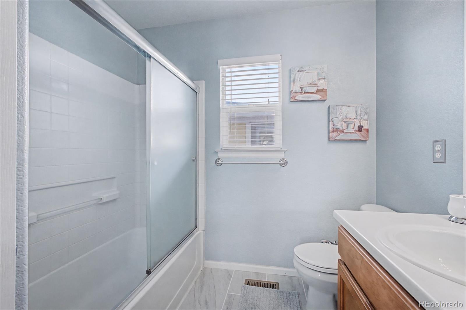 2921 Fulton Street Denver, CO 80238 - Photo 28 of 42 a bathroom with a toilet and a shower