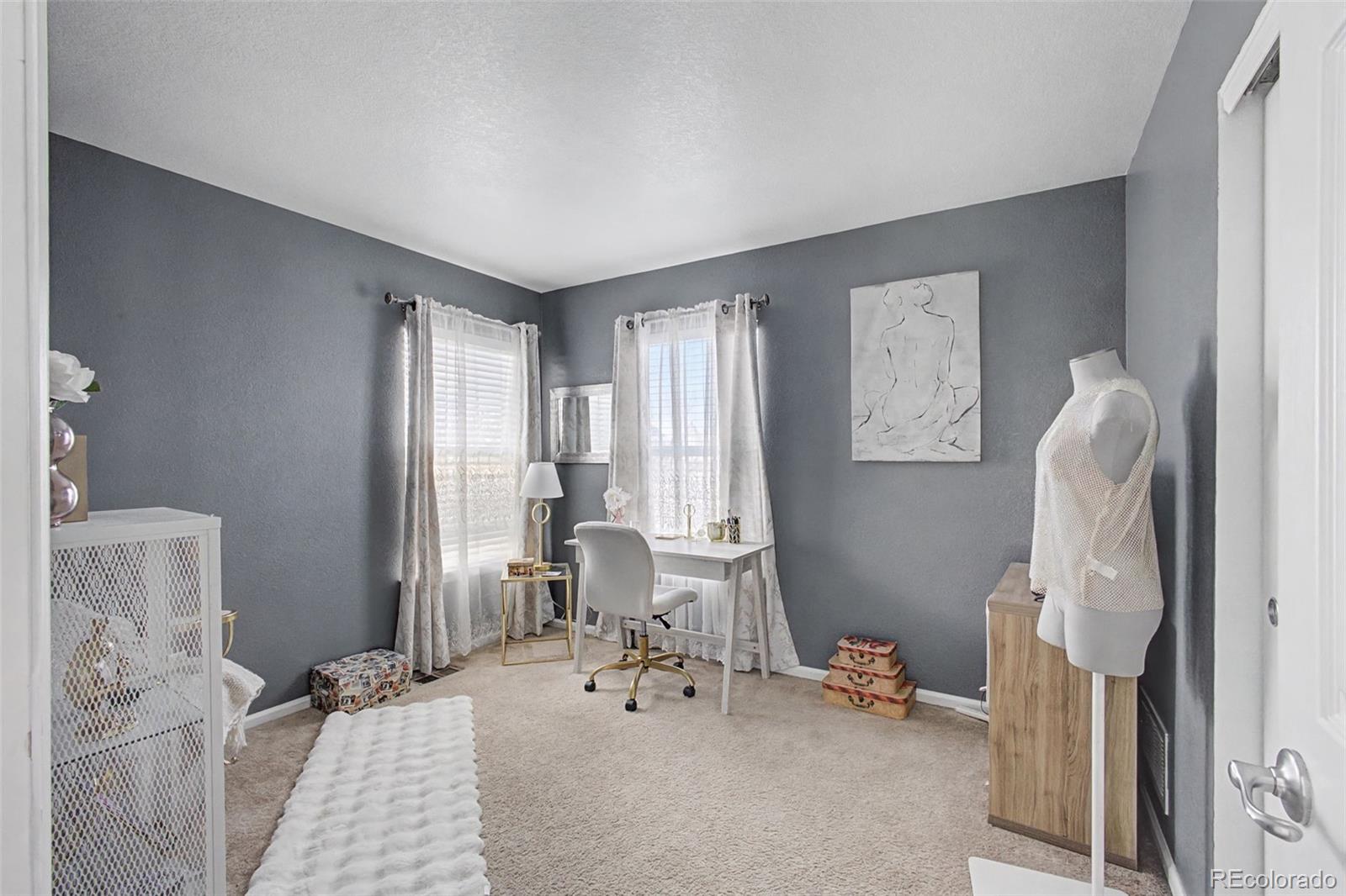 2921 Fulton Street Denver, CO 80238 - Photo 29 of 42 a bedroom with furniture and a large window