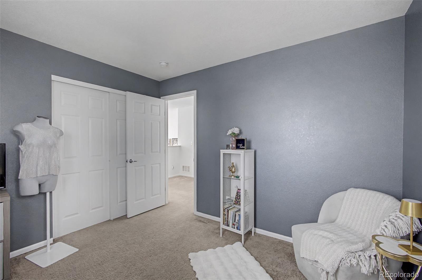 2921 Fulton Street Denver, CO 80238 - Photo 30 of 42 a living room with furniture and a gate