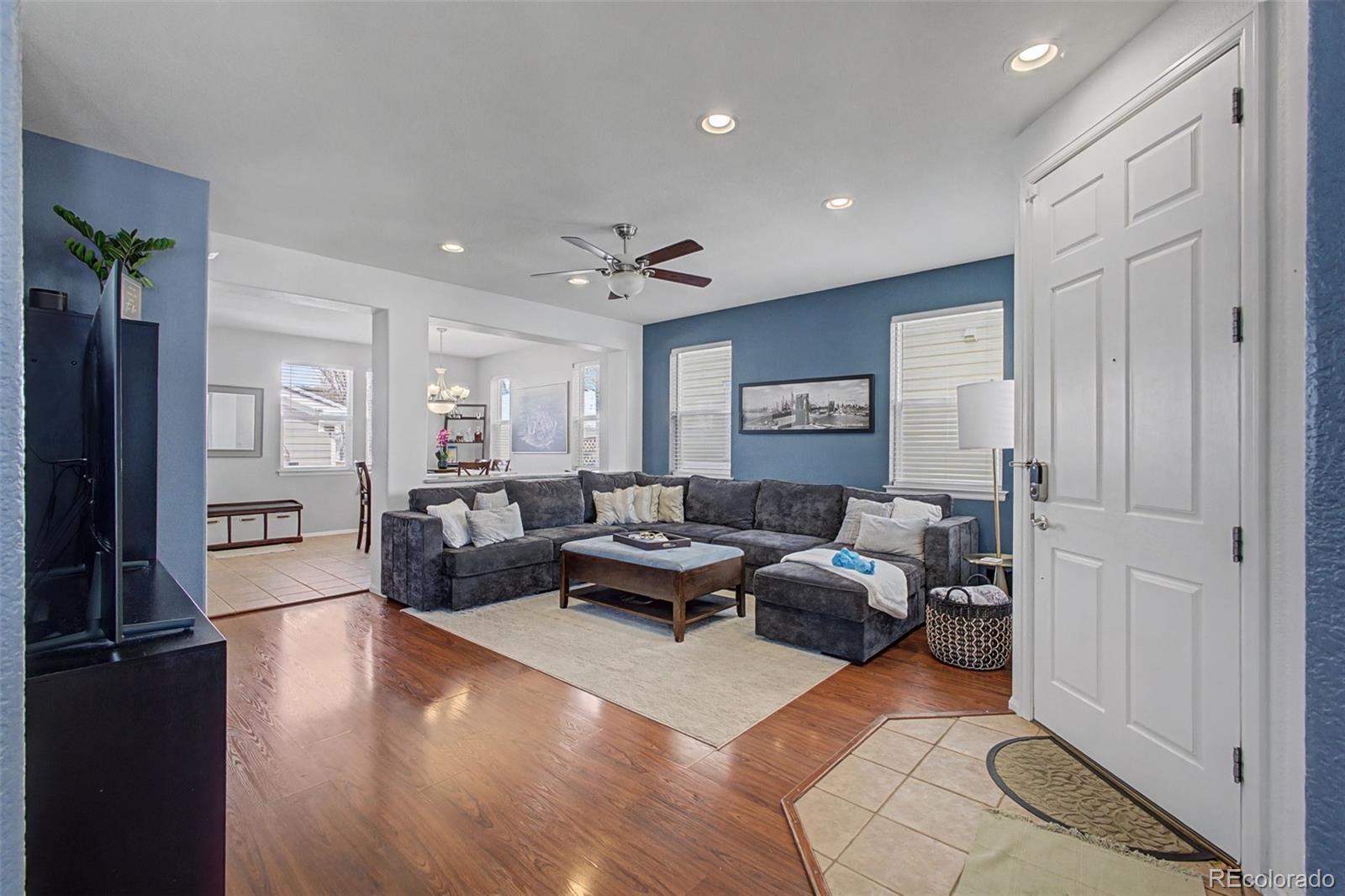 2921 Fulton Street Denver, CO 80238 - Photo 3 of 42 a living room with furniture and a to ceiling window