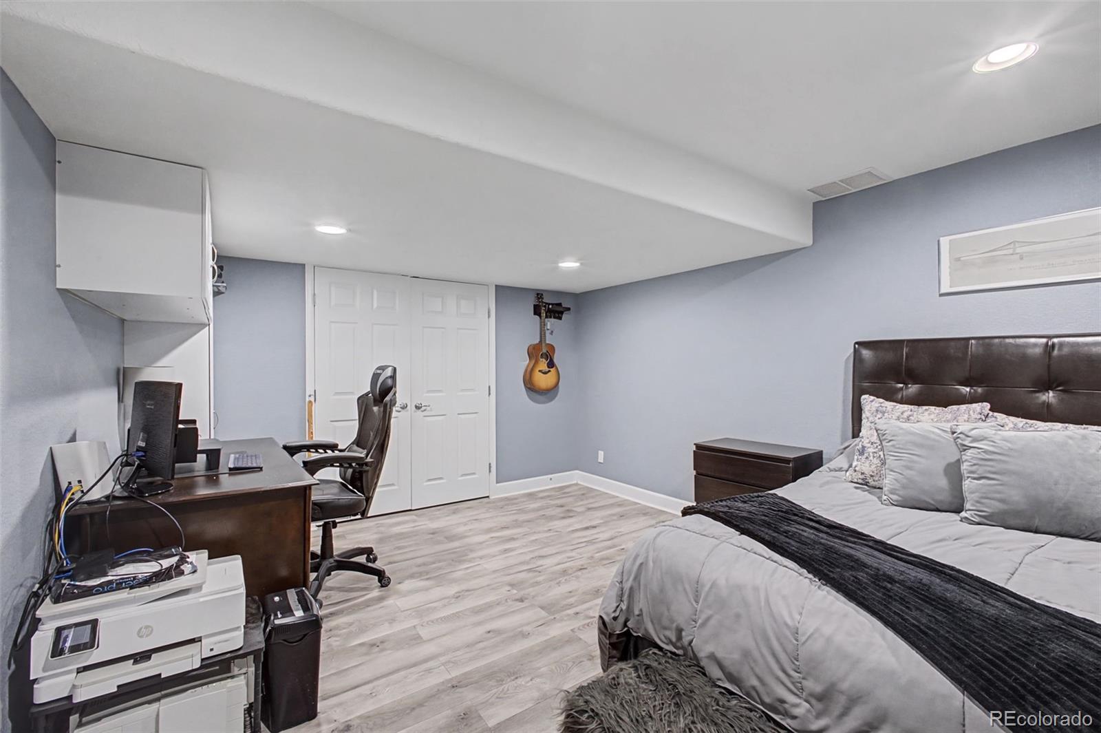 2921 Fulton Street Denver, CO 80238 - Photo 35 of 42 a bedroom with a bed and a desk