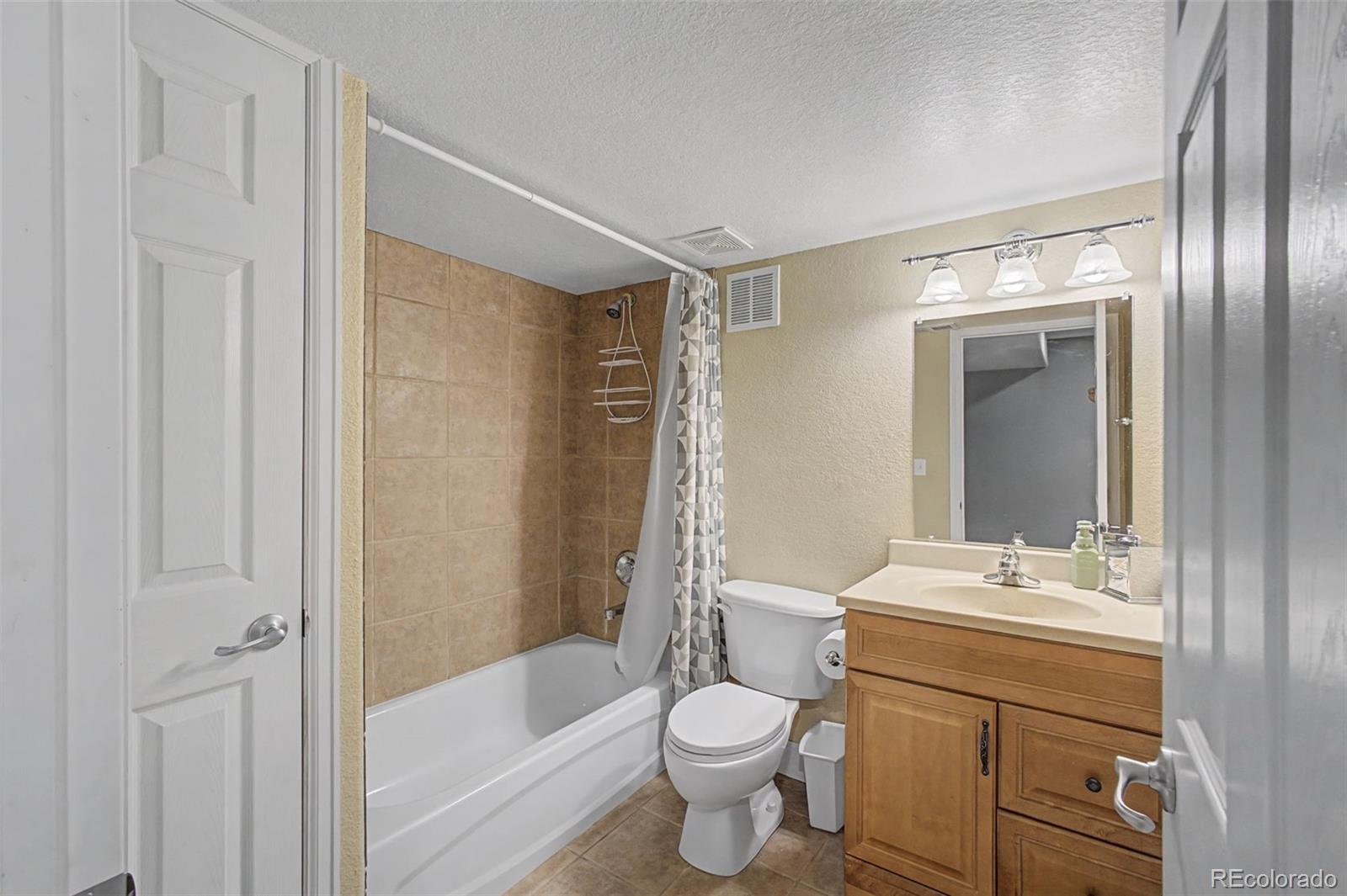 2921 Fulton Street Denver, CO 80238 - Photo 37 of 42 a bathroom with a sink toilet and shower
