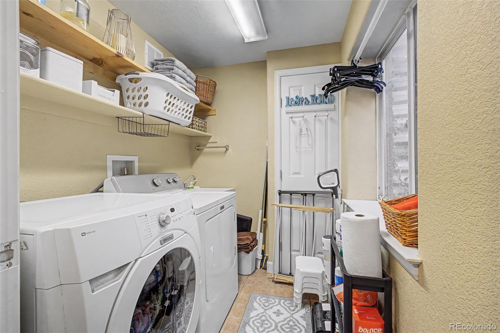 2921 Fulton Street Denver, CO 80238 - Photo 38 of 42 a view of storage and utility room with washer and dryer