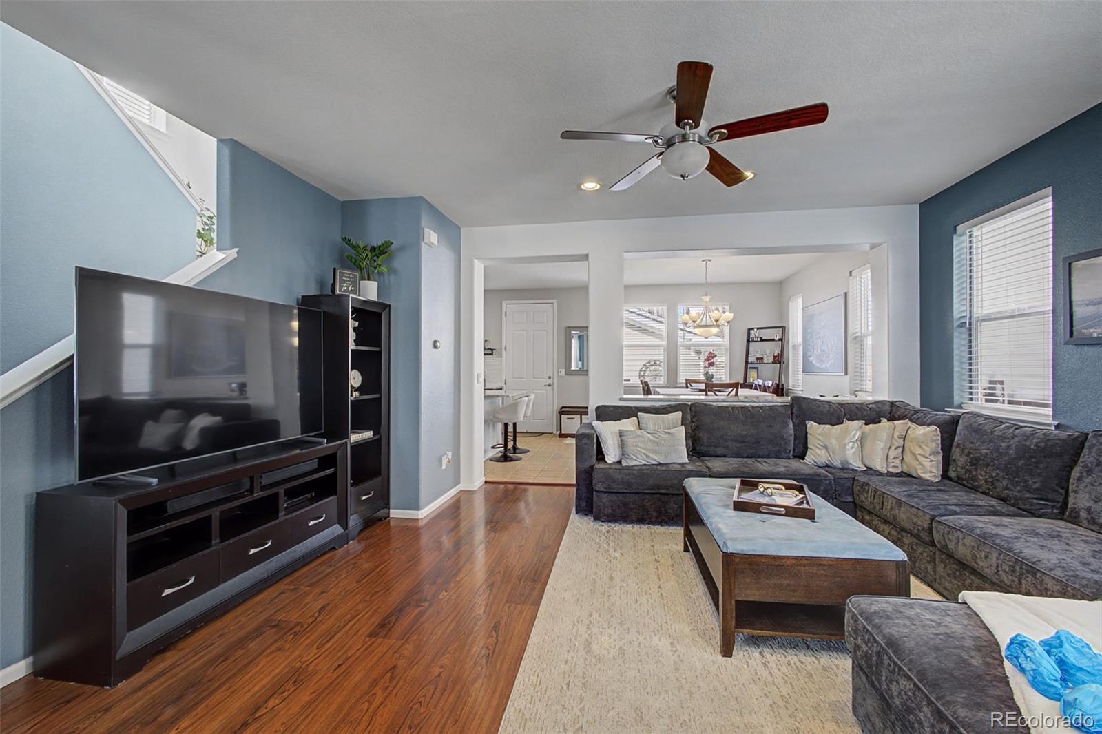 2921 Fulton Street Denver, CO 80238 - Photo 5 of 42 a living room with furniture and a flat screen tv