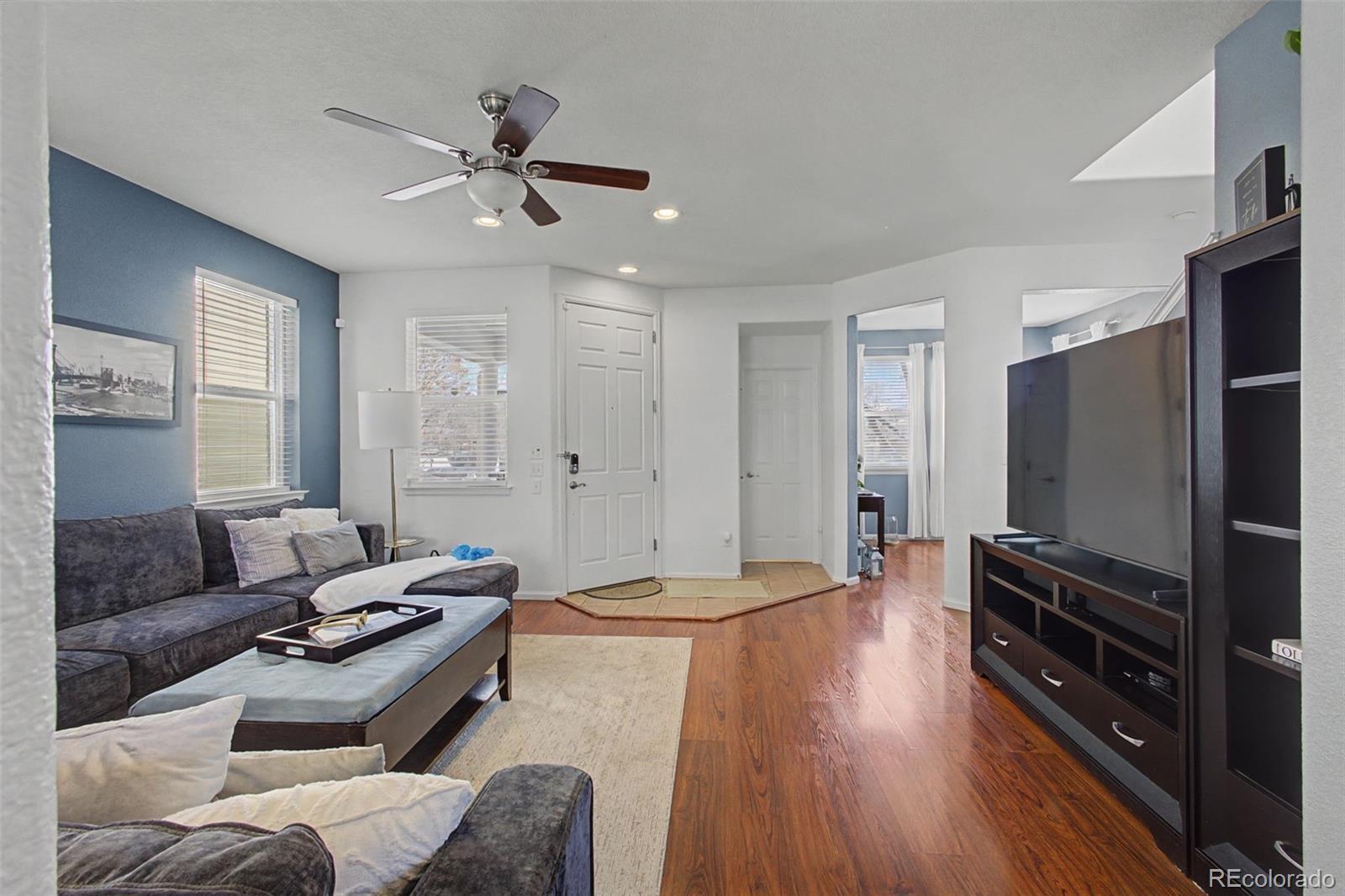 2921 Fulton Street Denver, CO 80238 - Photo 6 of 42 a living room with furniture and a flat screen tv