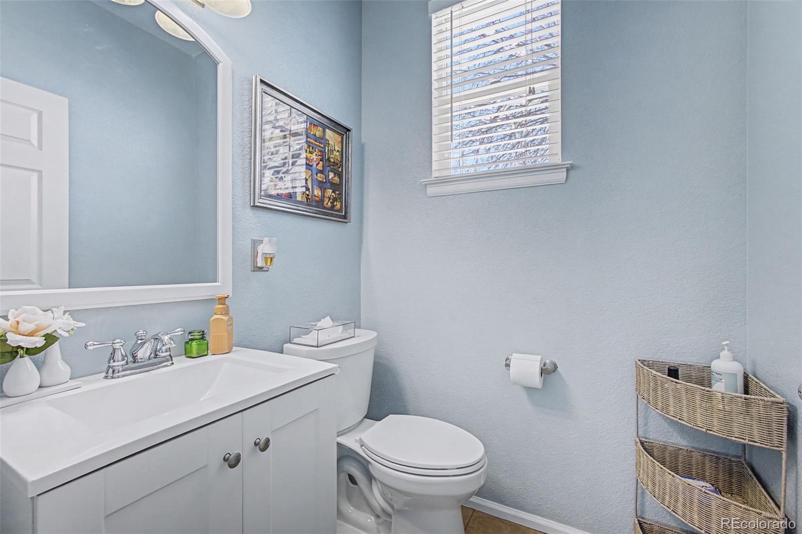 2921 Fulton Street Denver, CO 80238 - Photo 9 of 42 a bathroom with a sink toilet and a window