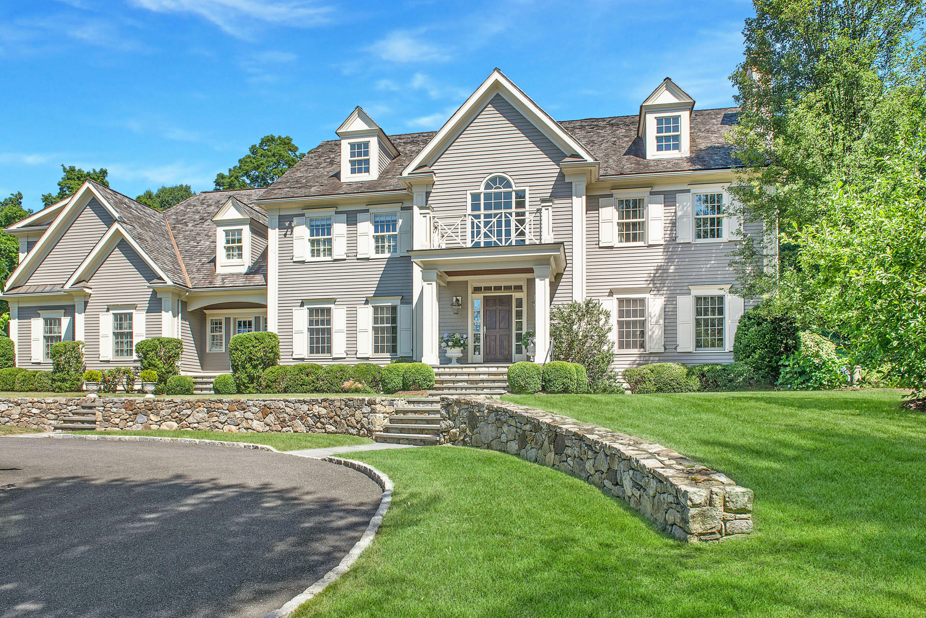 20 Silvermine Road New Canaan, CT 06840 - Photo 1 of 45 a front view of a house with a yard