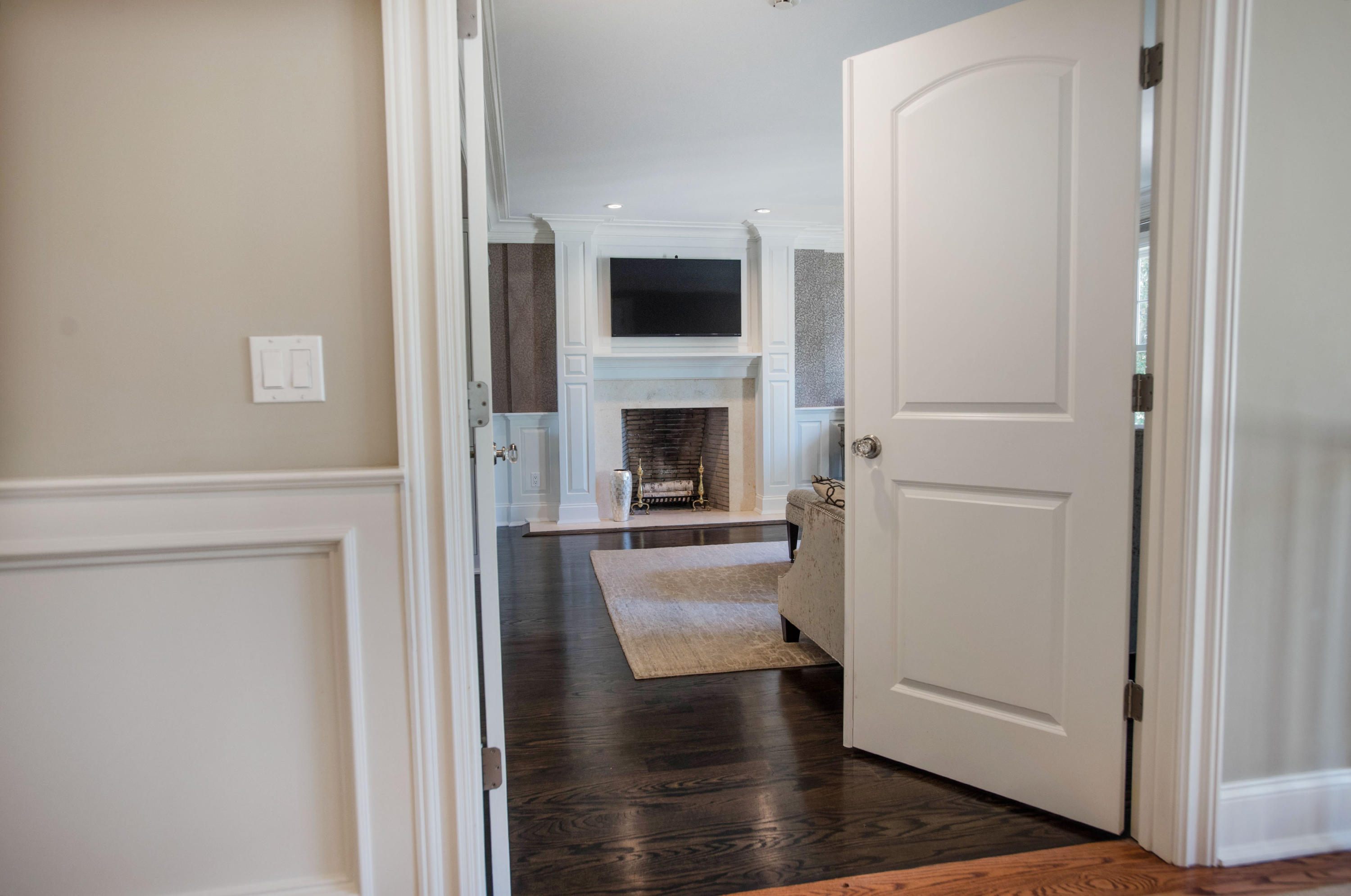 20 Silvermine Road New Canaan, CT 06840 - Photo 21 of 45 a view of a livingroom with an empty space and a fireplace