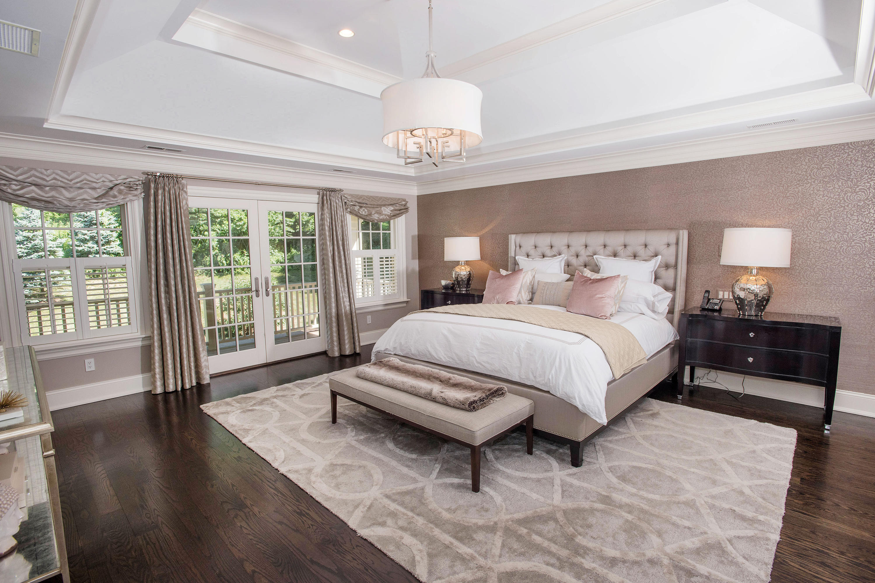 20 Silvermine Road New Canaan, CT 06840 - Photo 25 of 45 a spacious bedroom with a bed and a chandelier