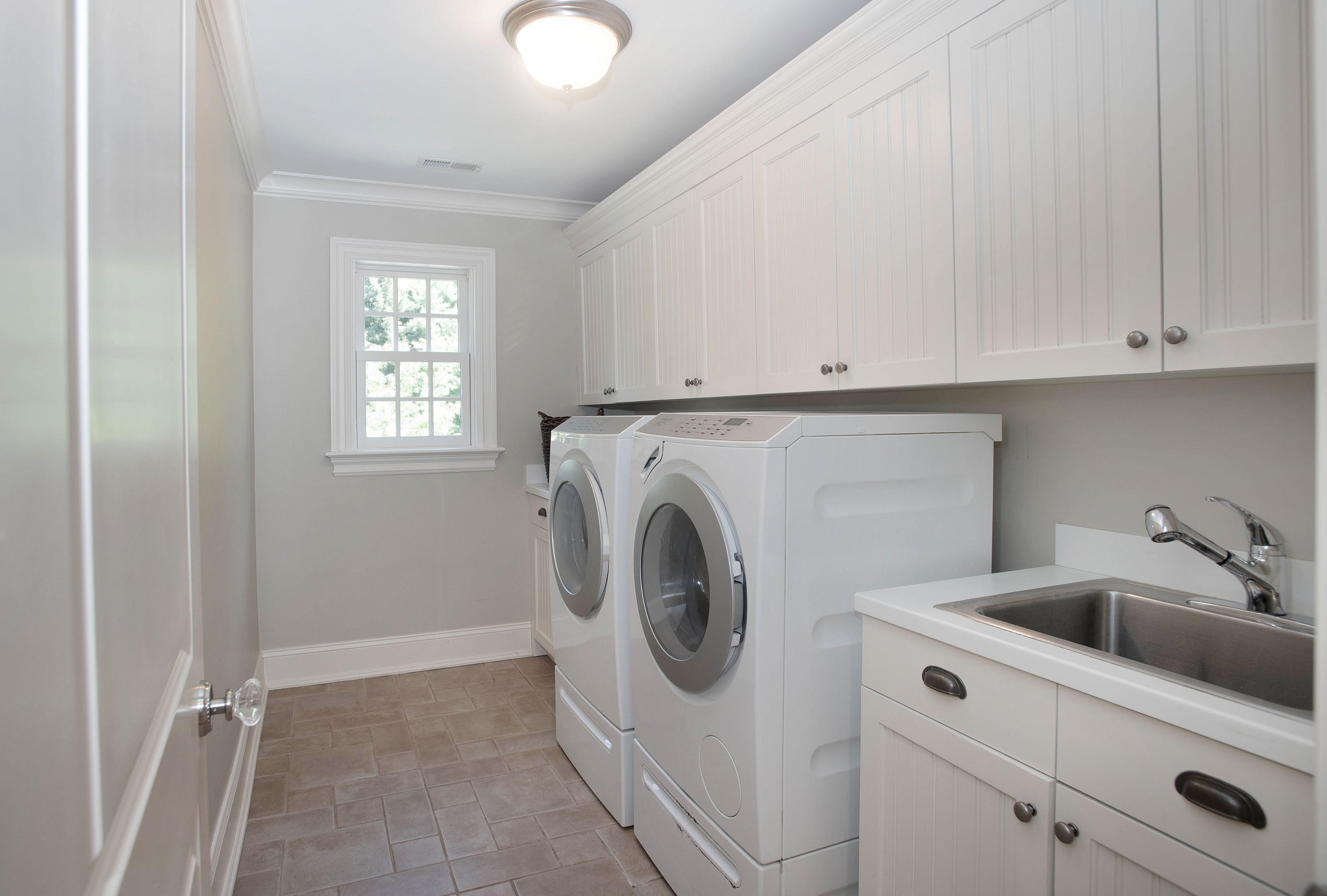 20 Silvermine Road New Canaan, CT 06840 - Photo 31 of 45 a utility room with sink dryer and washer