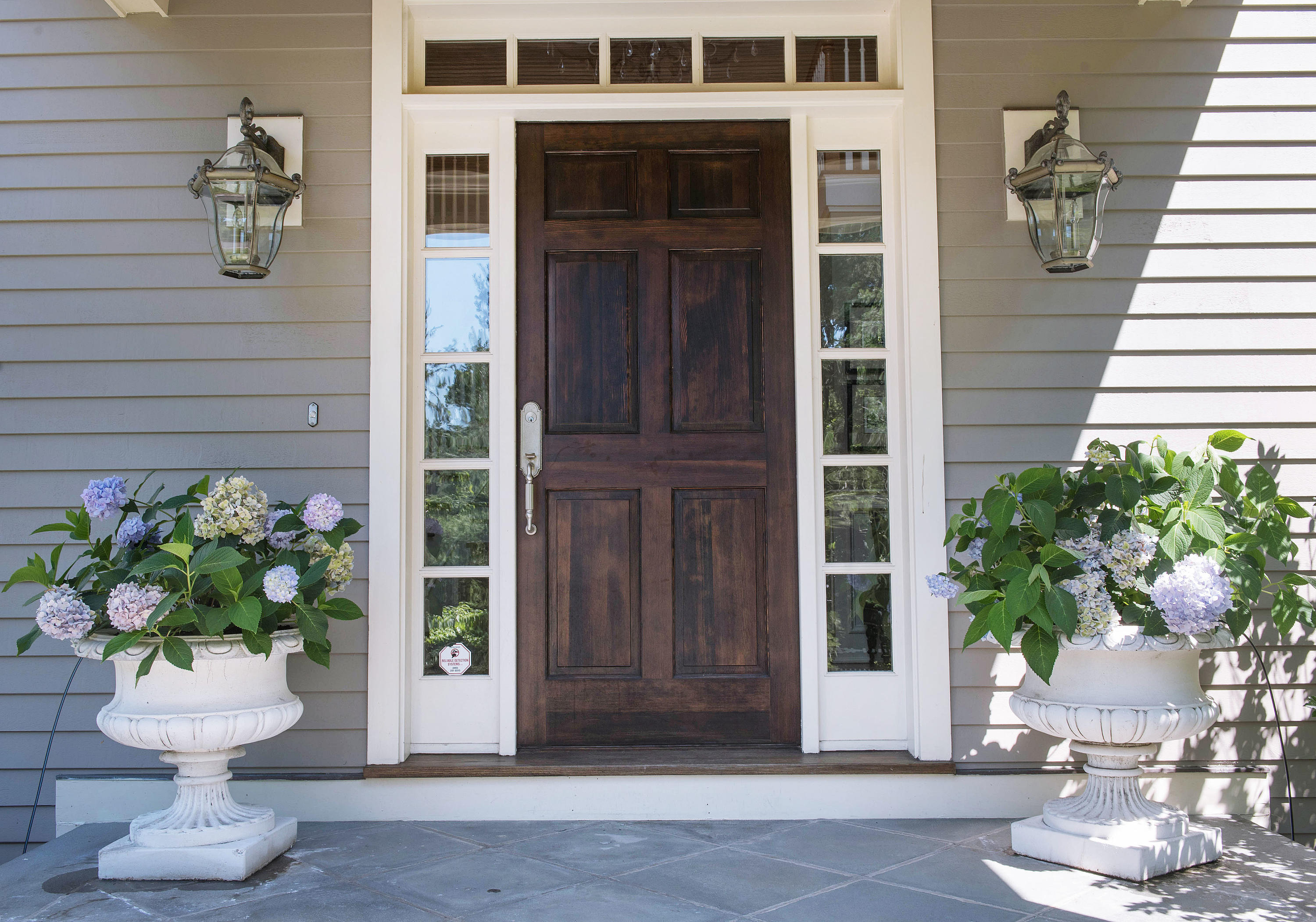 20 Silvermine Road New Canaan, CT 06840 - Photo 37 of 45 a view of a house with potted plants