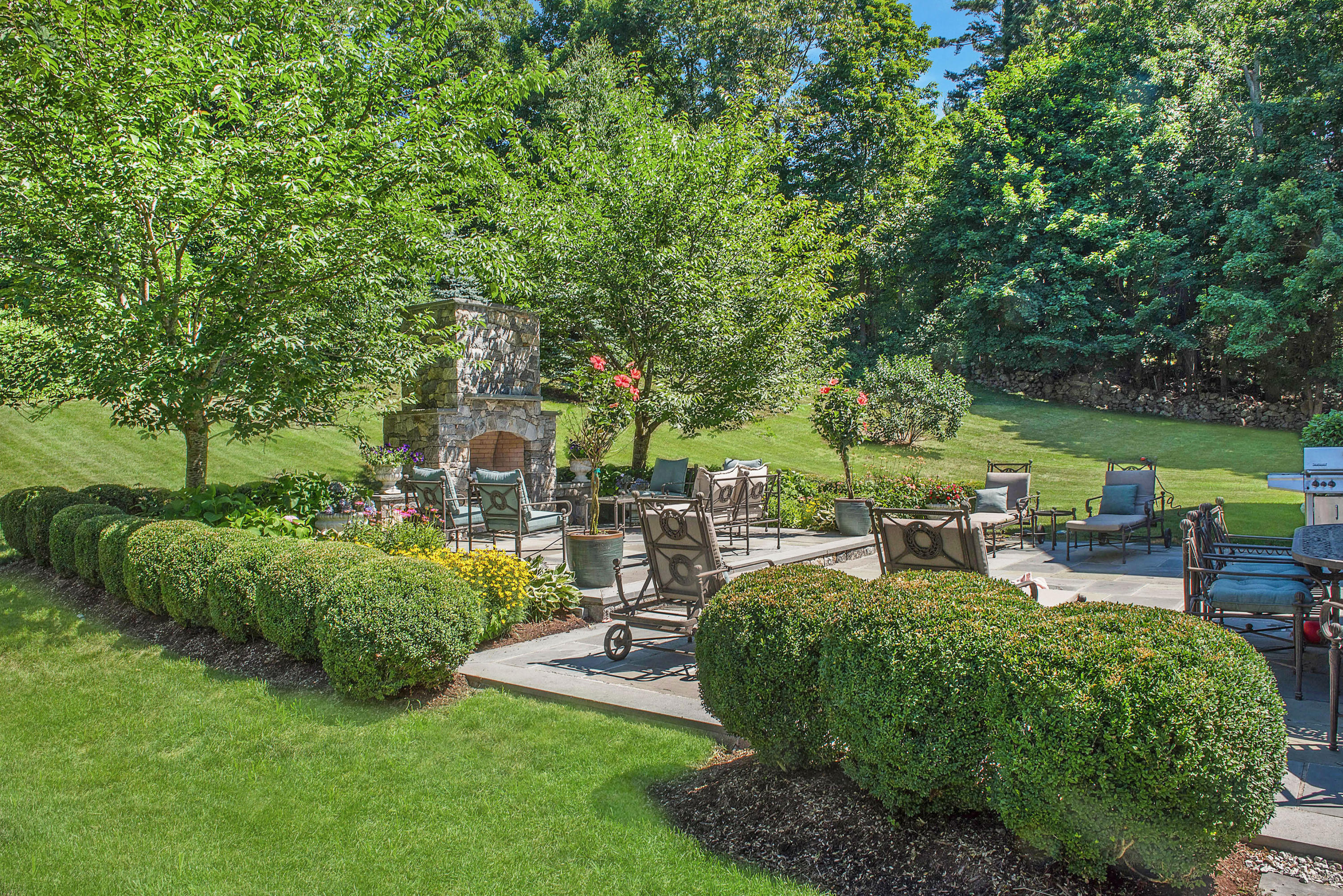 20 Silvermine Road New Canaan, CT 06840 - Photo 41 of 45 a view of a backyard with sitting area and garden