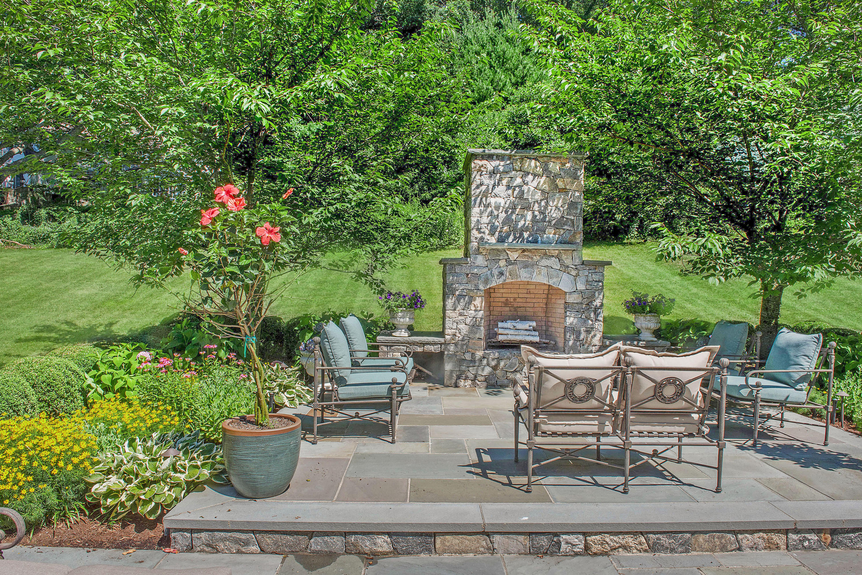 20 Silvermine Road New Canaan, CT 06840 - Photo 42 of 45 a view of a chairs and table in a patio
