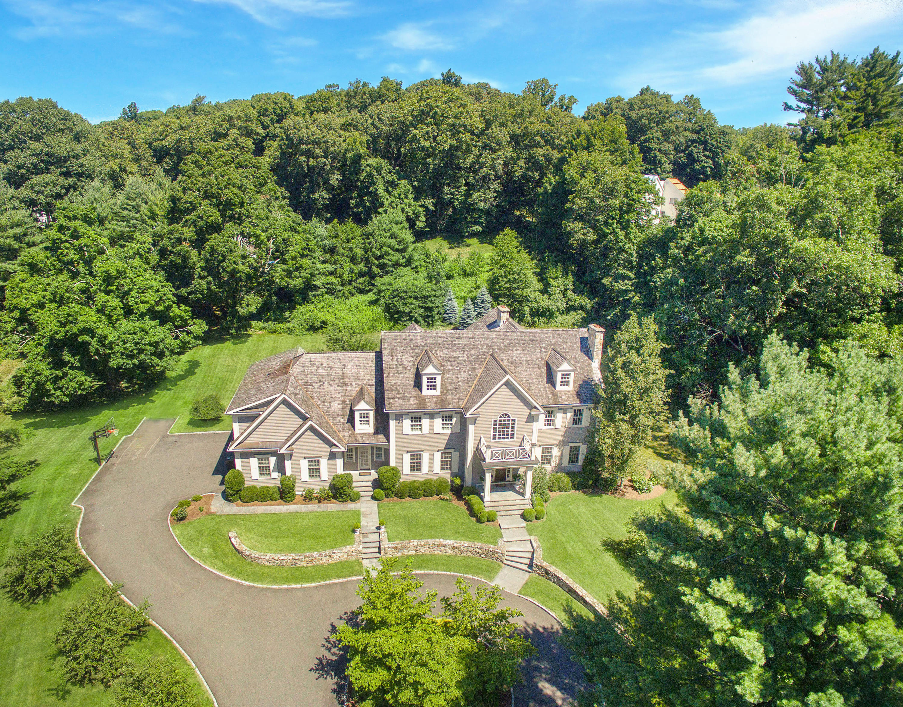 20 Silvermine Road New Canaan, CT 06840 - Photo 45 of 45 an aerial view of a house with swimming pool and mountain view