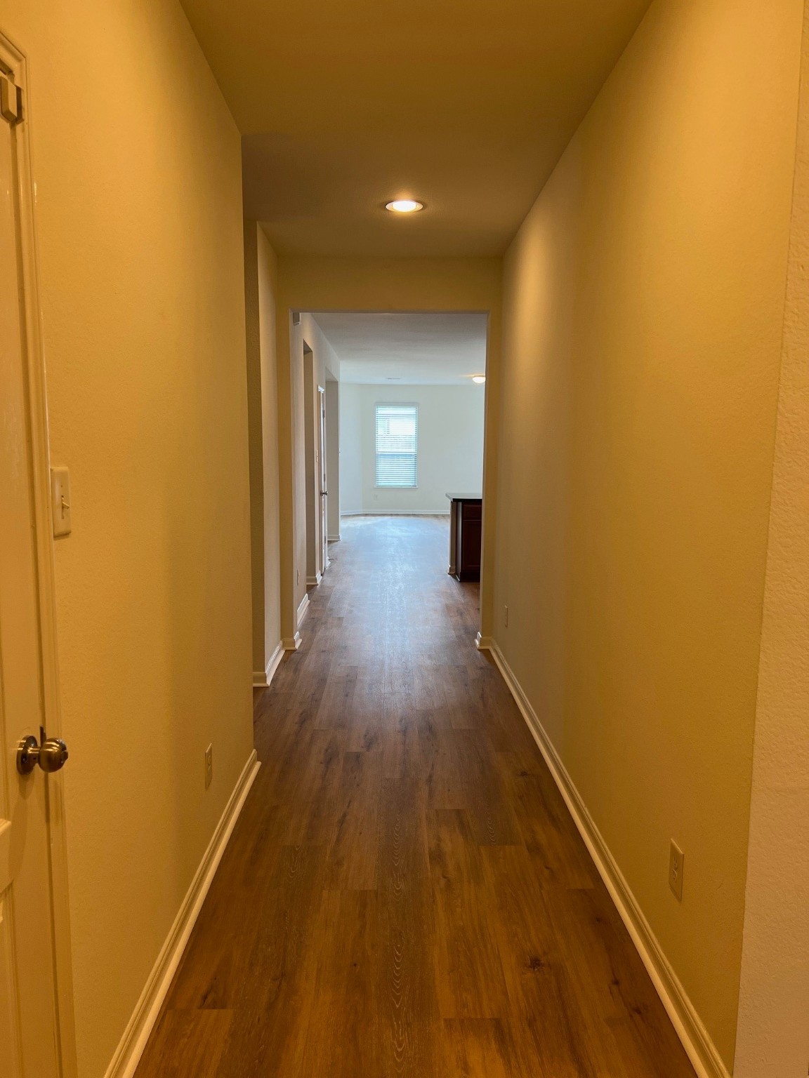 22511 Bellwick Ridge Lane Katy, TX 77449 - Photo 3 of 14 a view of a hallway with wooden floor
