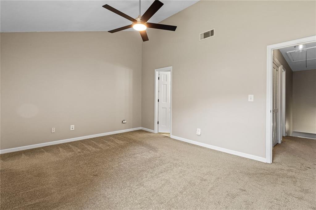 2217 Spring Walk Court Atlanta, GA 30341 - Photo 16 of 23 an empty room with closet and windows