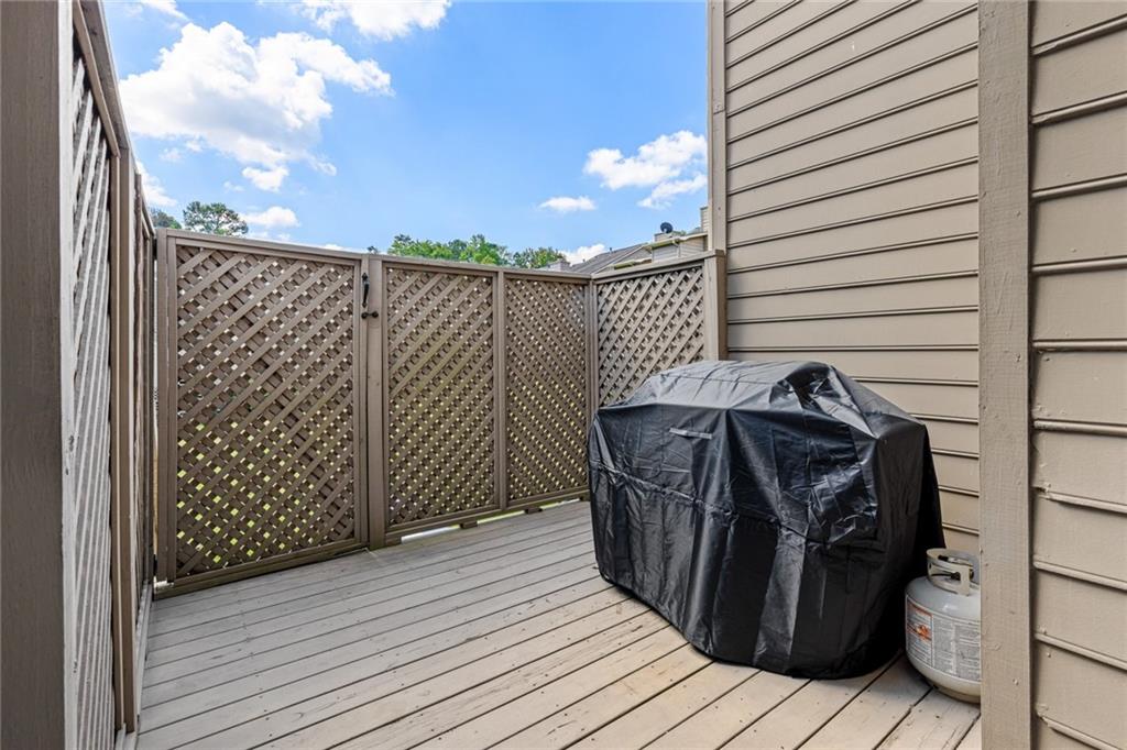 2217 Spring Walk Court Atlanta, GA 30341 - Photo 18 of 23 a view of a wooden balcony with an outdoor space