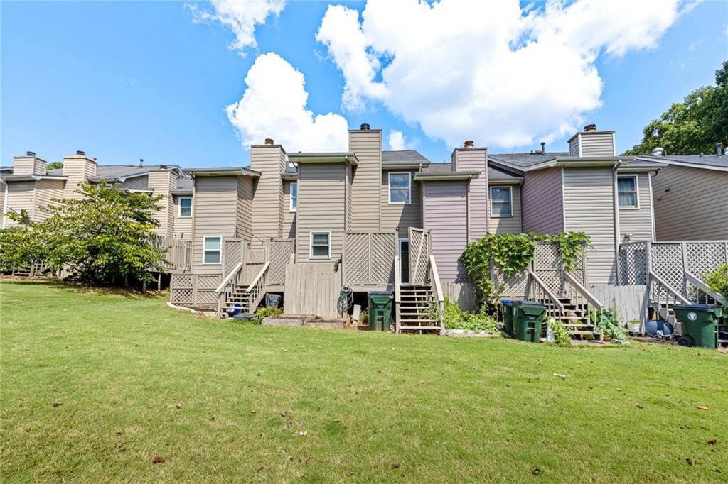 2217 Spring Walk Court Atlanta, GA 30341 - Photo 19 of 23 a view of a house with backyard and a tree