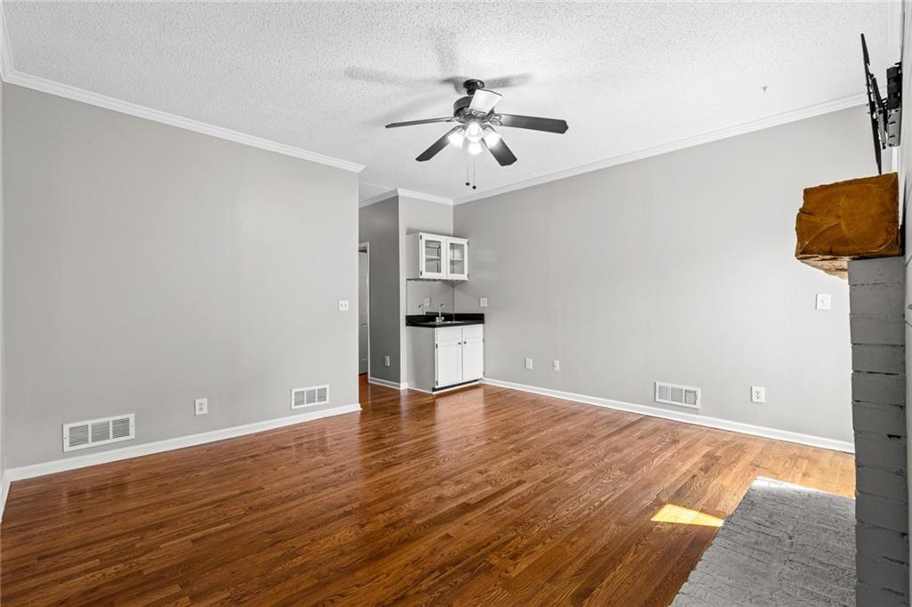 2217 Spring Walk Court Atlanta, GA 30341 - Photo 6 of 23 wooden floor in an empty room with a window