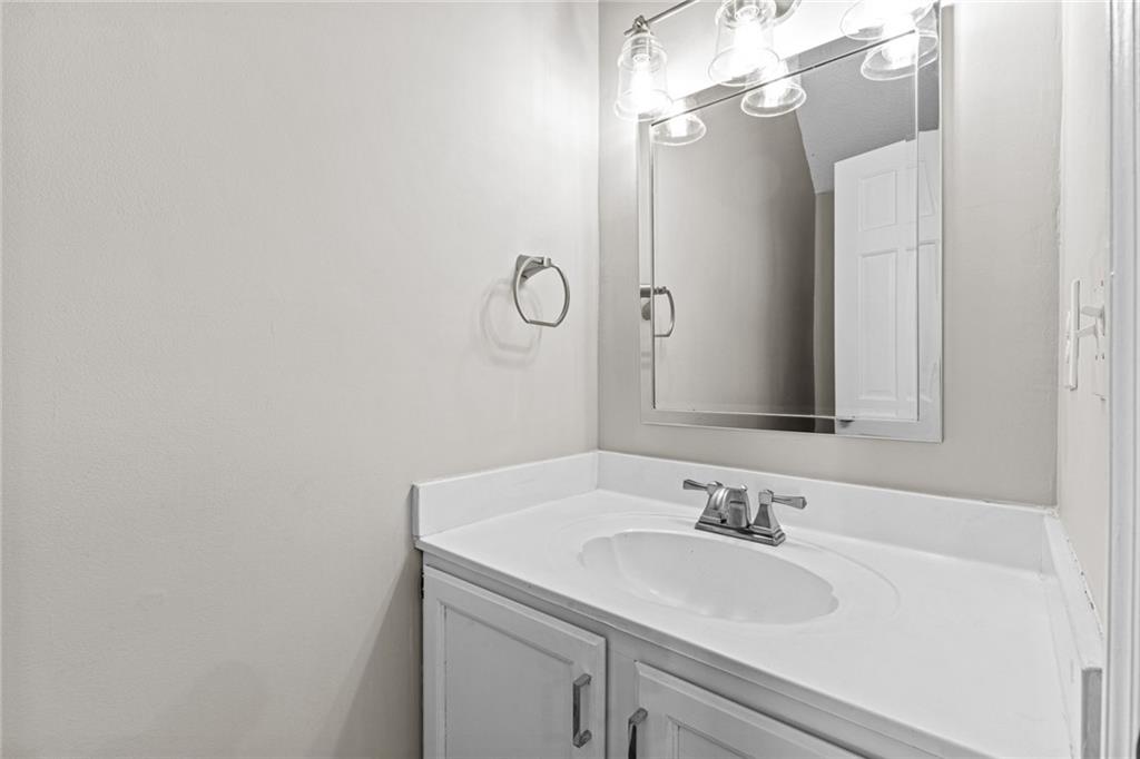 2217 Spring Walk Court Atlanta, GA 30341 - Photo 8 of 23 a bathroom with a sink and a mirror