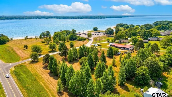 a view of a lake with a building in the background
