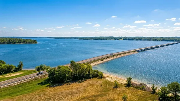 a view of a lake with a yard
