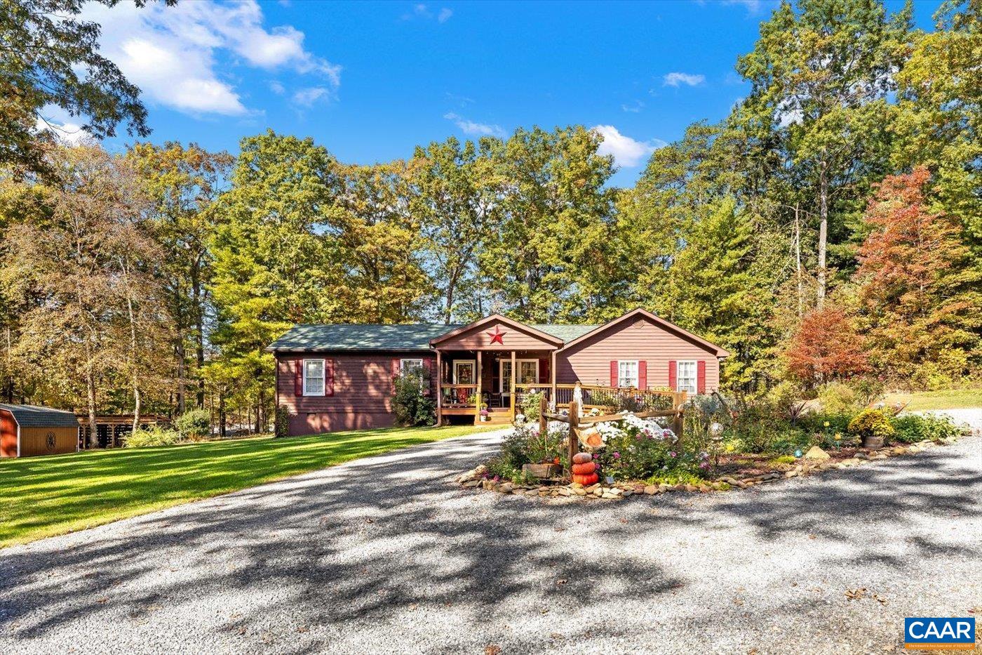 139 Happy Hollow Road Ruckersville, VA 22968 - Photo 8 of 45 a front view of a house with a garden and tree