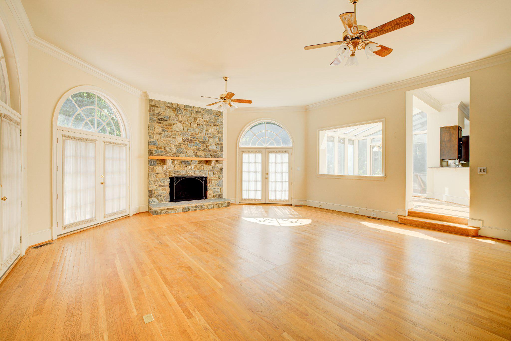 731 Utterback Store Road Great Falls, VA 22066 - Photo 4 of 19 Family room with natural light and warm hearth.