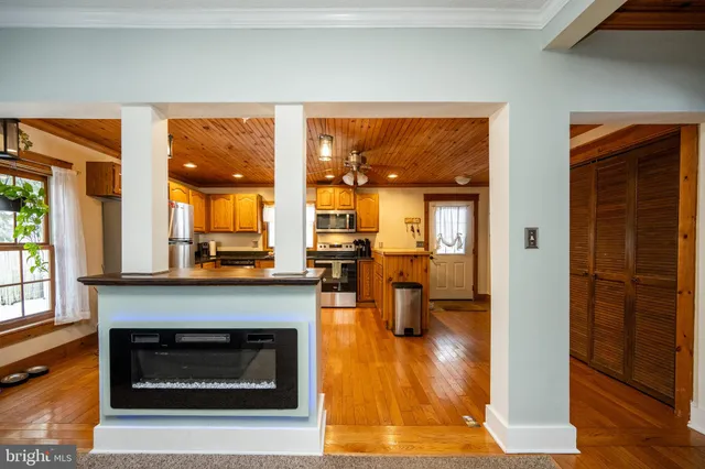 a kitchen with refrigerator and cabinets