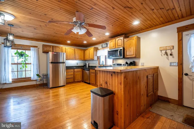 a bathroom with a sink a mirror and a shower
