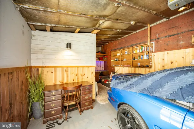 a view of a house with a yard and a tree