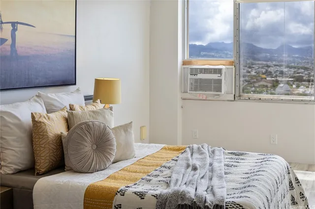 a bedroom with a bed and a window