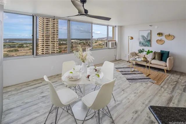 a view of a dining room with furniture and wooden floor