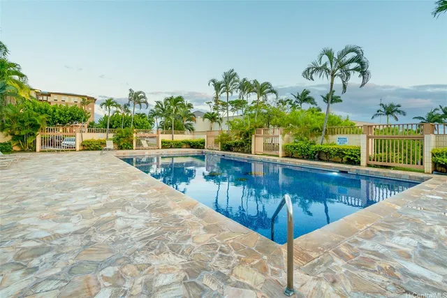 a view of swimming pool from a balcony