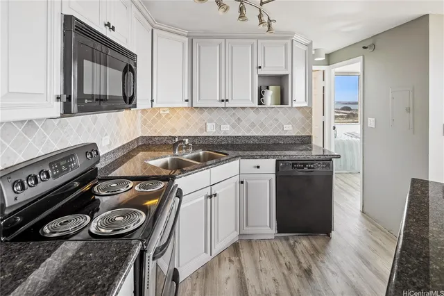 a kitchen with a stove and a refrigerator