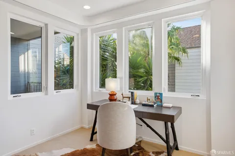 a living room with furniture and a window