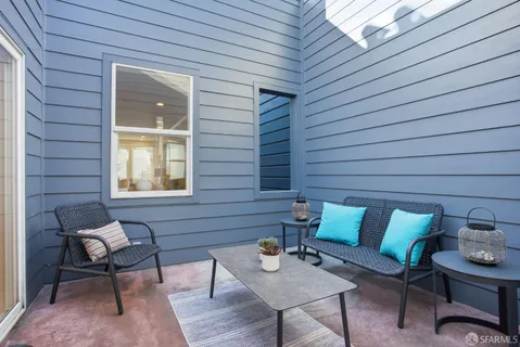 a outdoor living space with furniture and a window