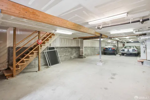 a view of parking garage with cars