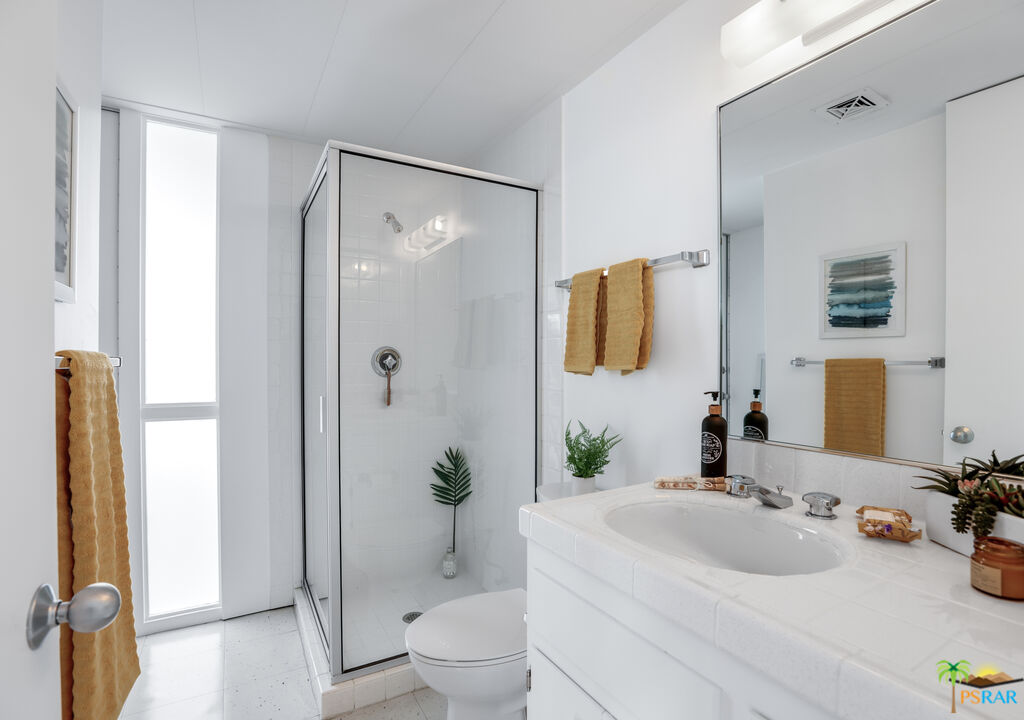 290 East Simms Road Palm Springs, CA 92262 - Photo 27 of 37 a bathroom with a sink toilet and shower