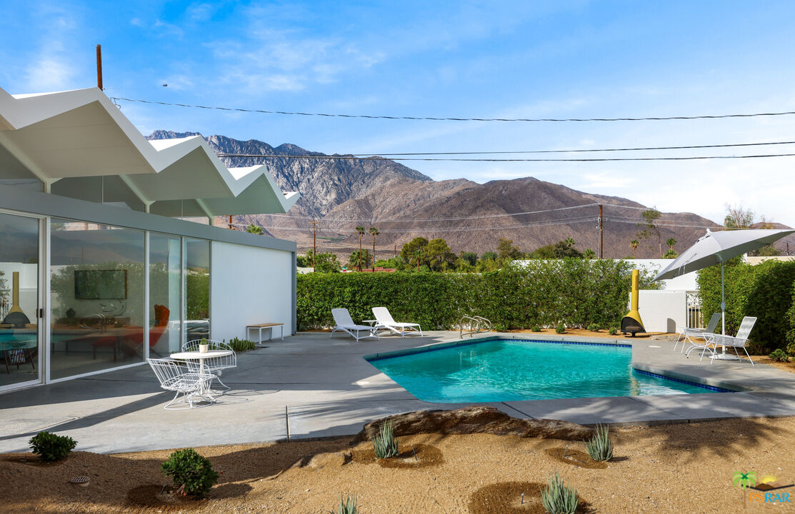 290 East Simms Road Palm Springs, CA 92262 - Photo 32 of 37 a view of a house with backyard and sitting area