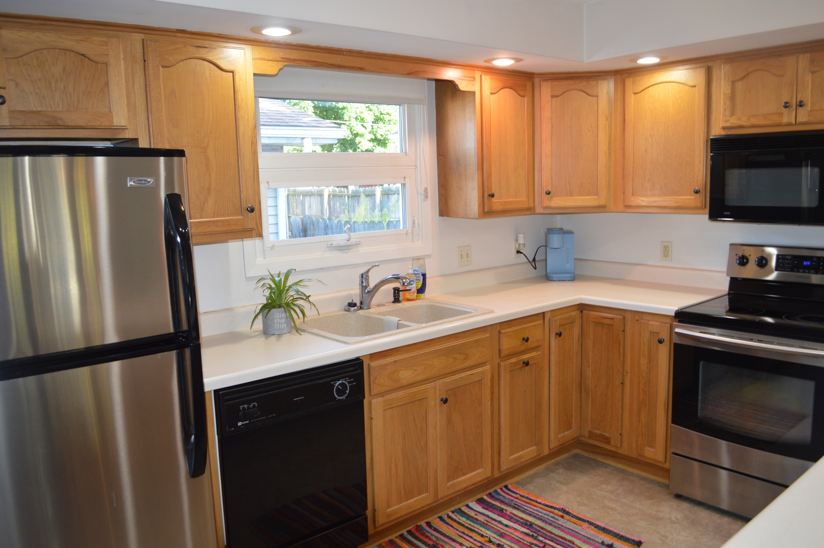 523 North Knox Street Princeton, IL 61356 - Photo 8 of 22 a kitchen with stainless steel appliances a refrigerator sink and white cabinets