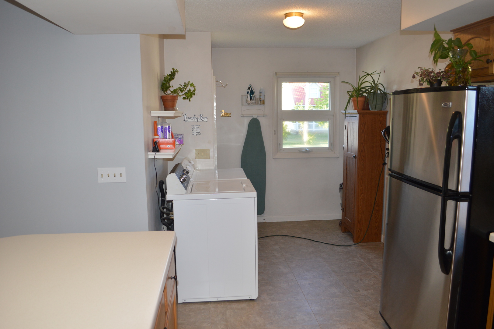 523 North Knox Street Princeton, IL 61356 - Photo 9 of 22 a utility room with refrigerator and washer