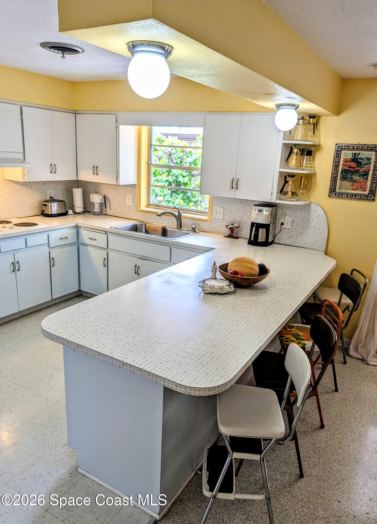 615 Oak Ridge Drive Indialantic, FL 32903 - Photo 11 of 65 Kitchen Breakfast Bar