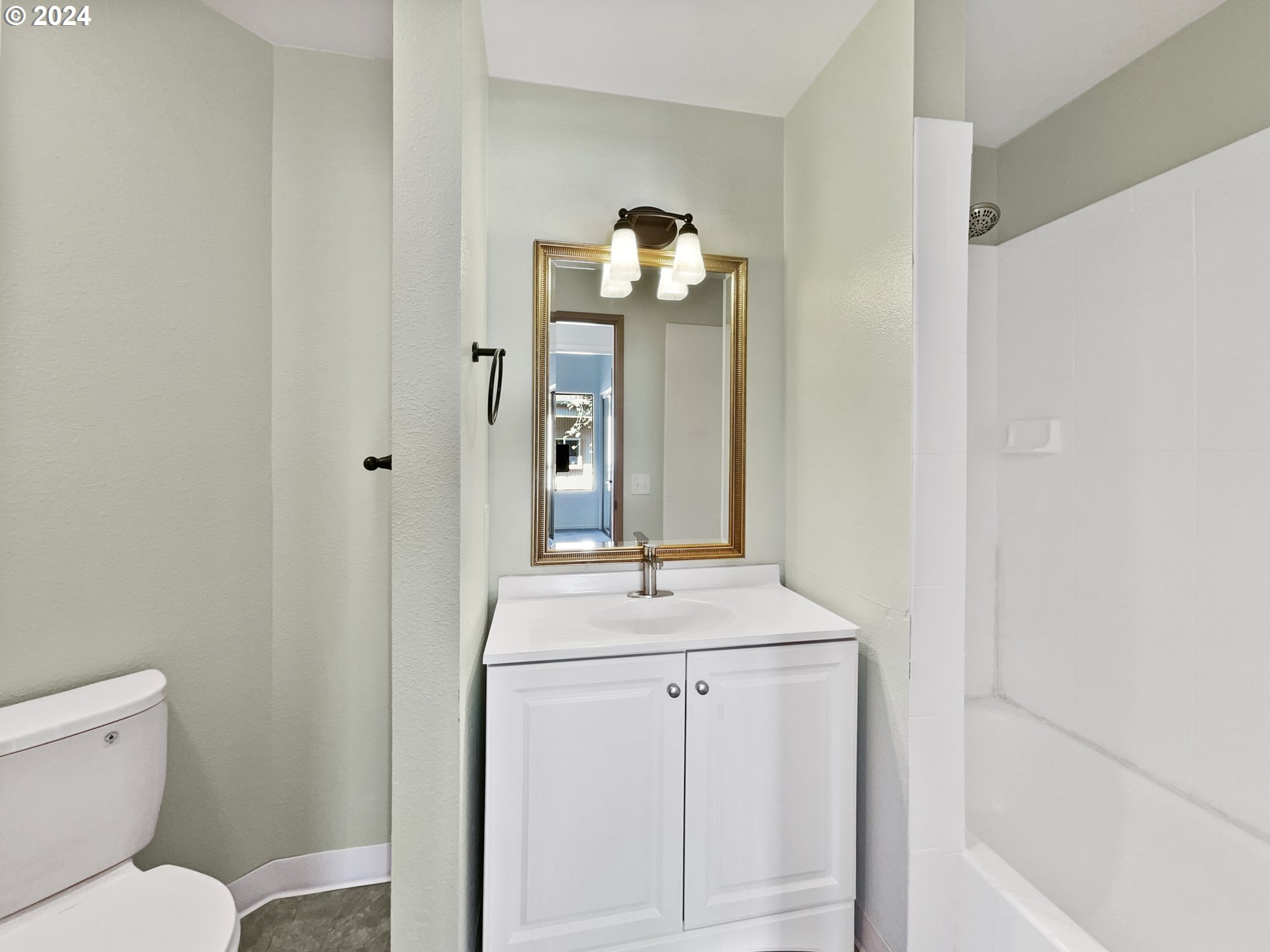 11621 Southwest 43rd Avenue Portland, OR 97219 - Photo 13 of 19 a bathroom with a toilet sink and mirror