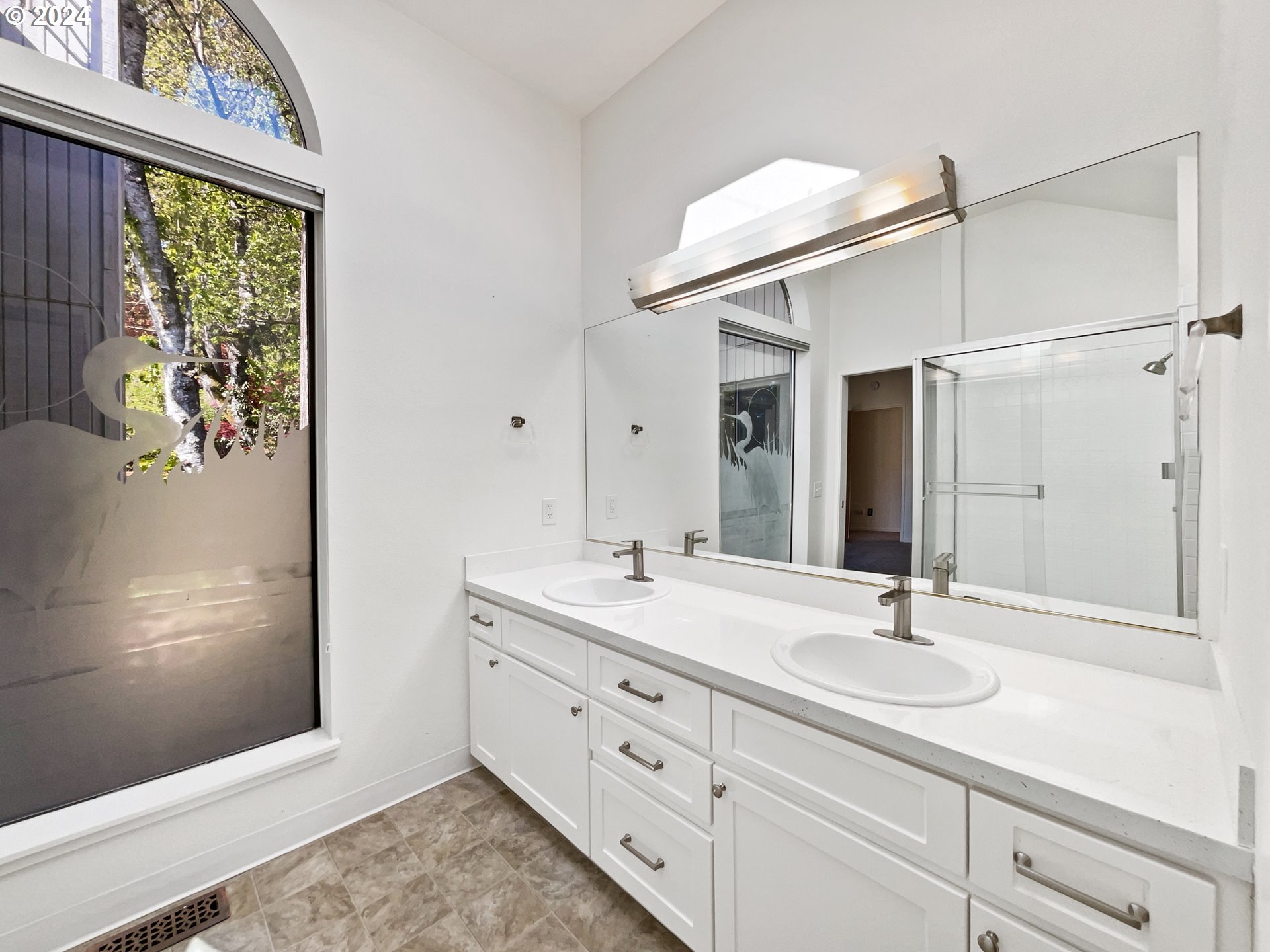 11621 Southwest 43rd Avenue Portland, OR 97219 - Photo 17 of 19 a bathroom with a sink and a mirror