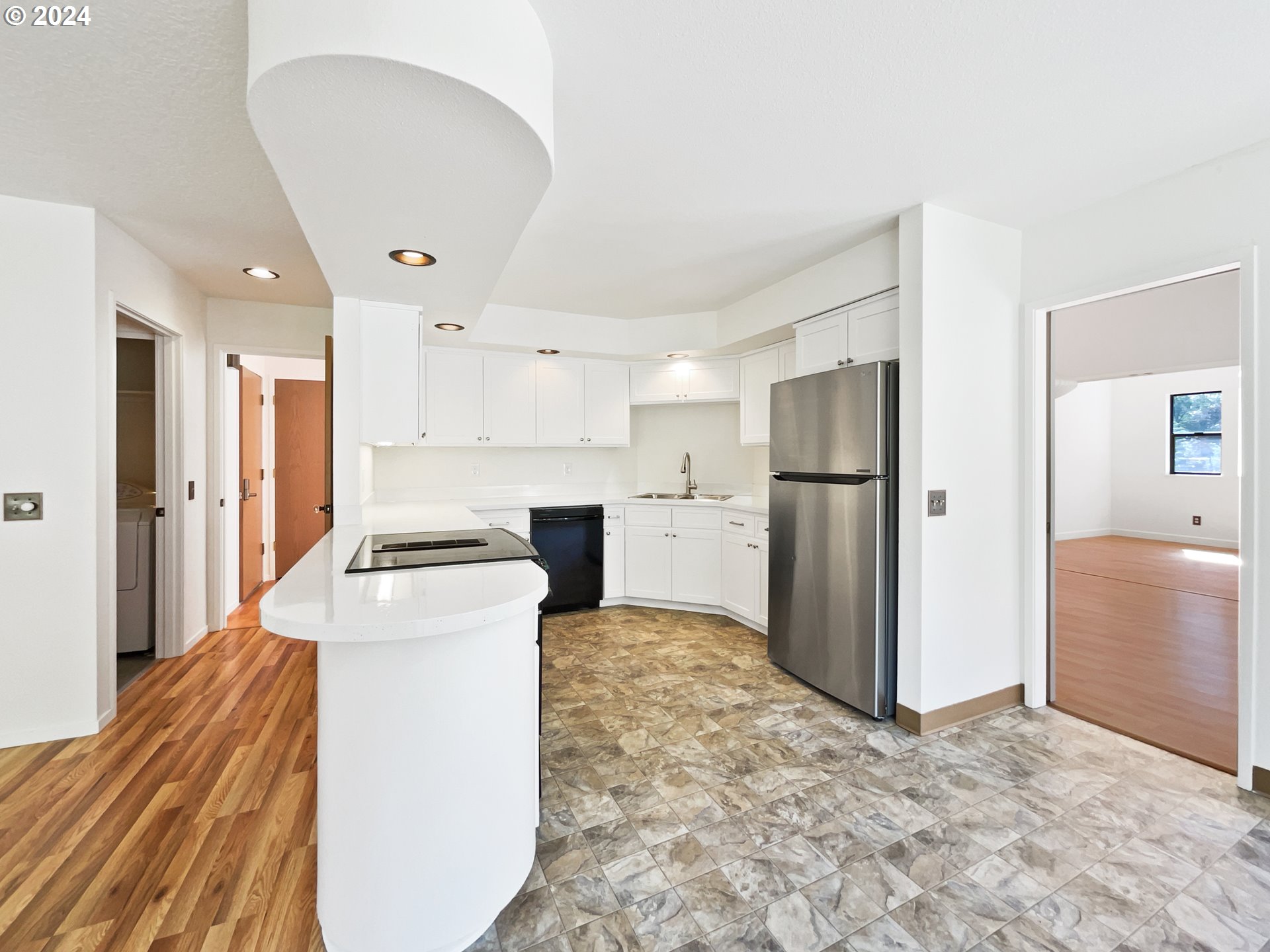 11621 Southwest 43rd Avenue Portland, OR 97219 - Photo 2 of 19 a kitchen with a refrigerator a sink and a stove