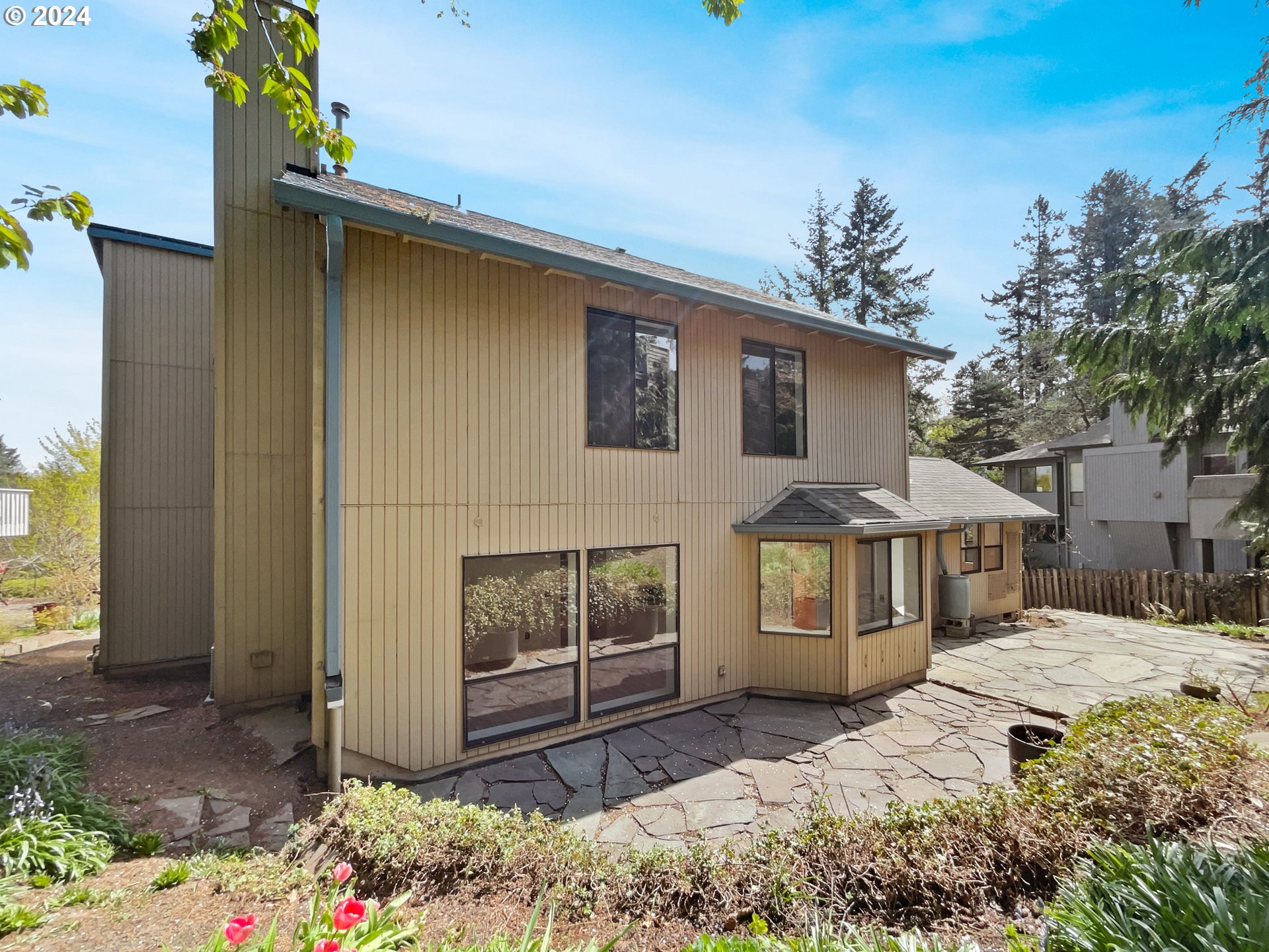 11621 Southwest 43rd Avenue Portland, OR 97219 - Photo 5 of 19 a front view of a house with a yard
