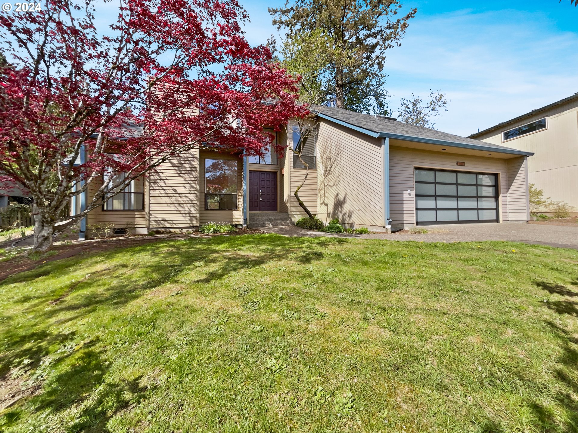 11621 Southwest 43rd Avenue Portland, OR 97219 - Photo 10 of 19 a house with a yard