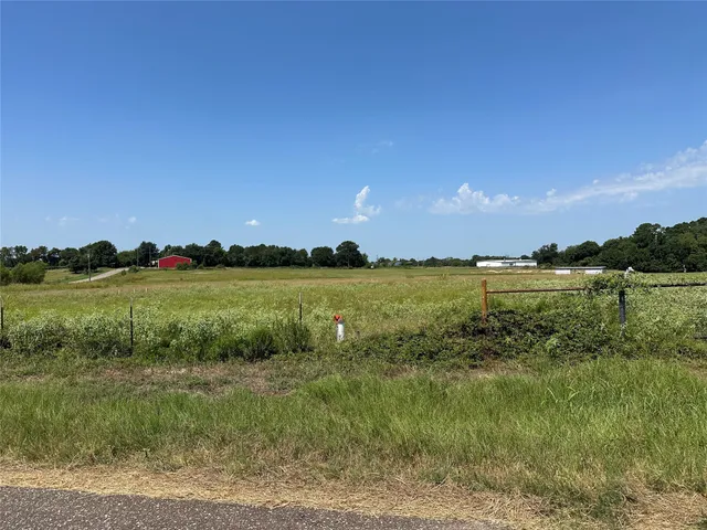 a view of a lake with houses in the background